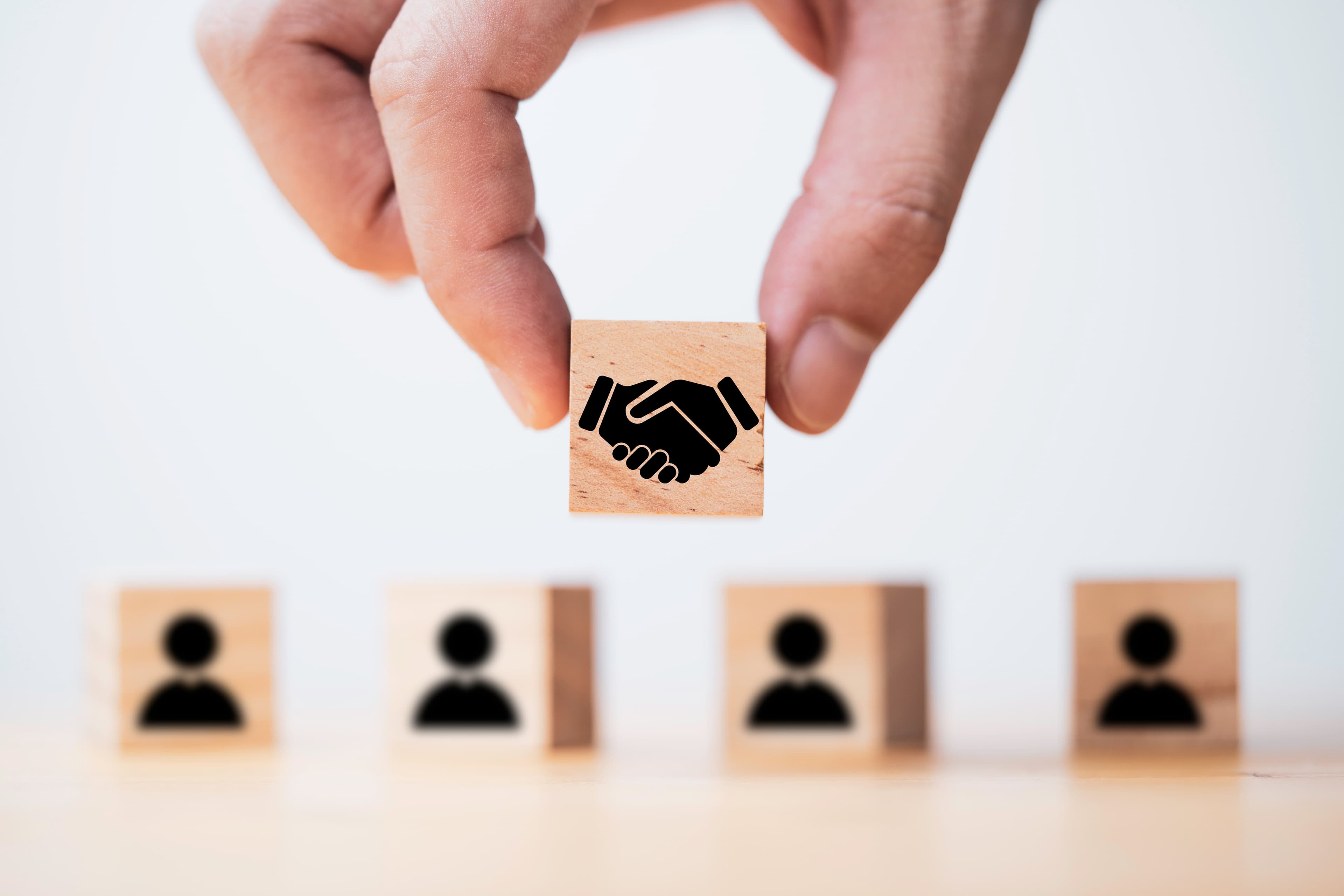 Hand holding wooden cube